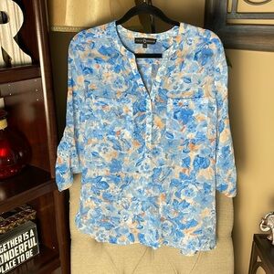 Lightweight semi sheer blouse.